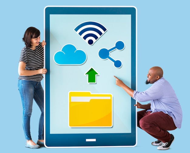 Photo diverse couple holding a tablet with graphics