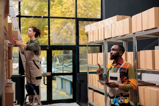 Diverse employees working at storehouse inventory