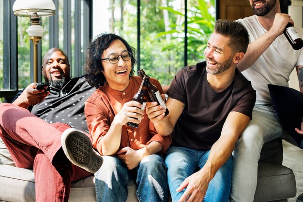 Diverse friends drinking beers together