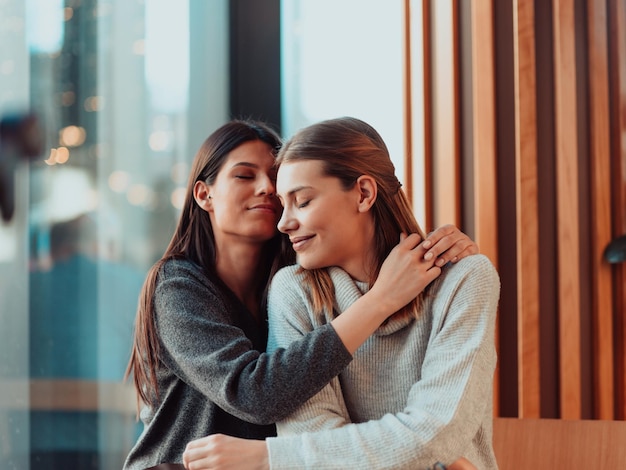 Diverse girls lesbian couple hugging. Close up portrait. Stylish cool generation z women dating in love enjoy romantic relationships. Lgbtq concept.