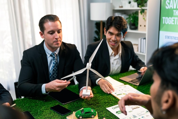 Diverse group of business people planning for alternative energy utilization for greener sustainable Earth by reducing CO2 emission and carbon credit with renewable clean energy technology Quaint