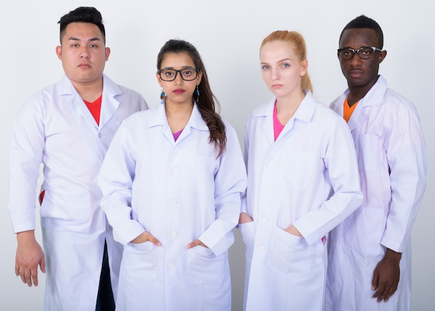 diverse group of multi ethnic doctors standing together