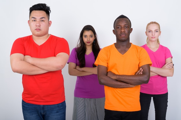 diverse group of multi ethnic friends standing with their arms crossed