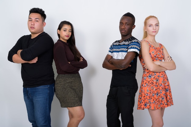 diverse group of multi ethnic friends with arms crossed