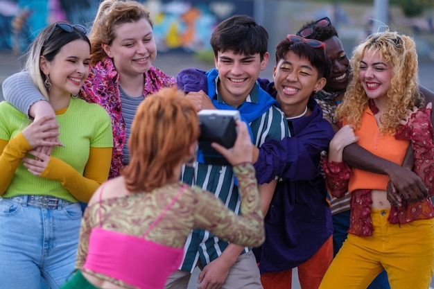 Diverse group of teenagers celebrating together outdoors