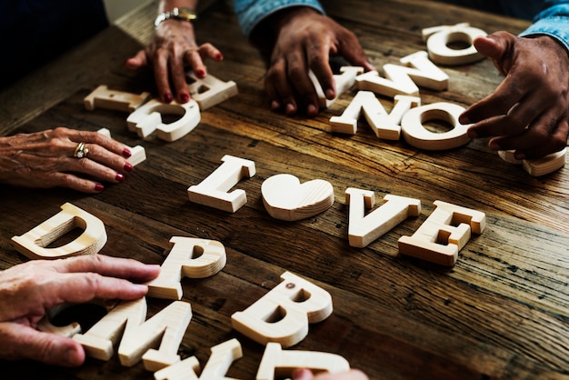 Photo diverse hands spelling out love