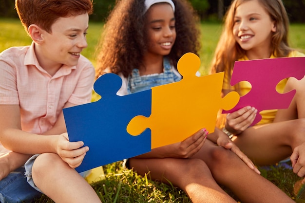 Diverse kids playing with puzzles together