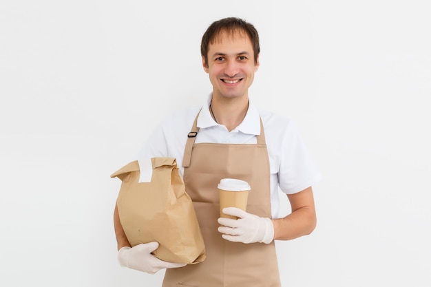 Diverse of paper containers for takeaway food. Delivery man is carrying