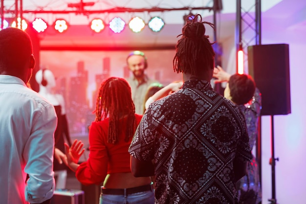 Diverse people clubbing on dancefloor