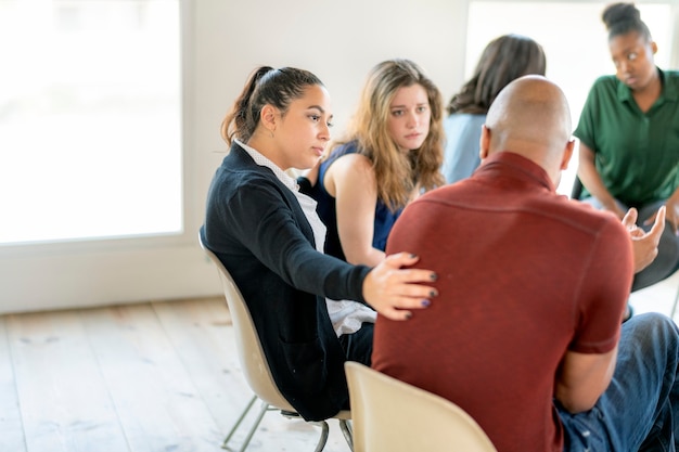 Diverse people in a support group session