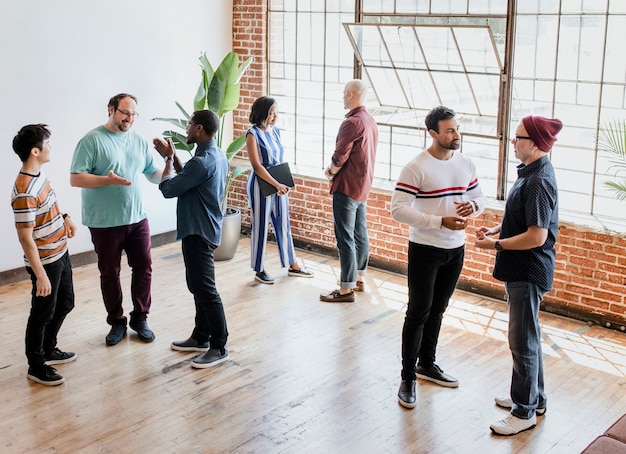 Diverse people talking in groups during a break