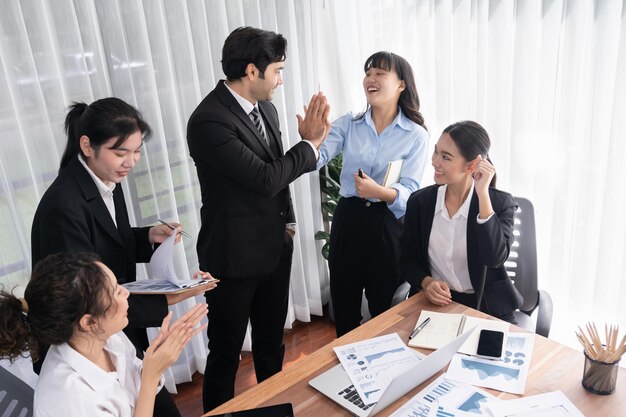 Diverse race office worker celebrate after made progress meticulous