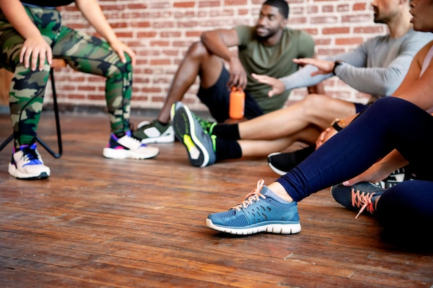 Diverse sporty people resting after a tough workout