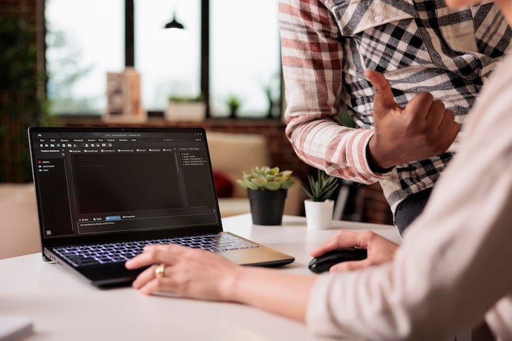 Photo diverse web developers programming html script at home, using encryption and program code to develop new user interface. learning online app security firewall on terminal window, coding server.