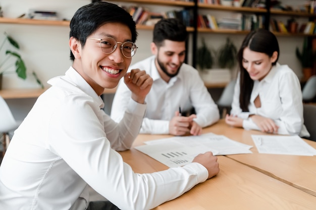 Diverse young people work in the office