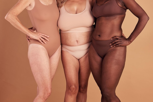 Diversity closeup or women with body positivity wellness or support on brown studio background Multiracial females or ladies with solidarity skincare or confident for natural beauty or community