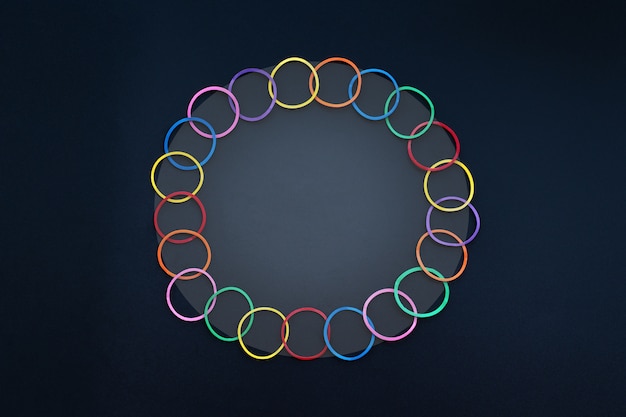 Diversity concept mix colorful rubber band on black background with copy space