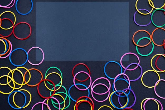 Diversity concept mix colorful rubber band on black background with tcopy space