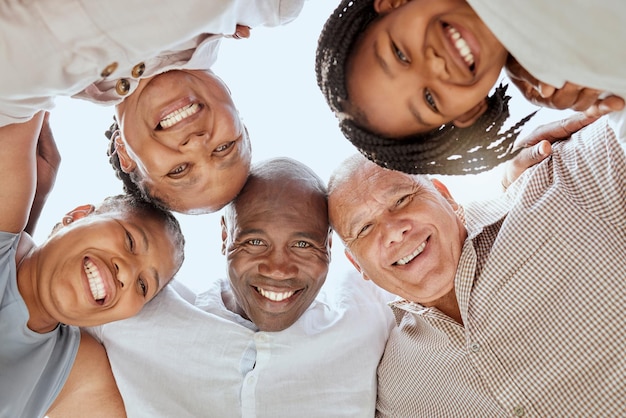 Diversity family and huddle together smile and positive being loving happy and embrace Portrait interracial and happiness to connect mixed race people and support for hug bonding and love