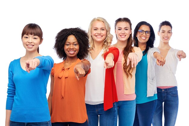 diversity, race, ethnicity, choice and people concept - international group of happy smiling different women over white pointing finger at you