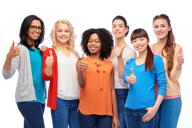 diversity, race, ethnicity and people concept - international group of happy smiling different women over white showing thumbs up