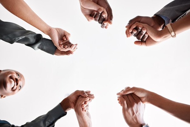 Photo diversity support and collaboration of business people holding hands below in trust for company success team of corporate workers in a circle of success in a meeting together at a corporate company