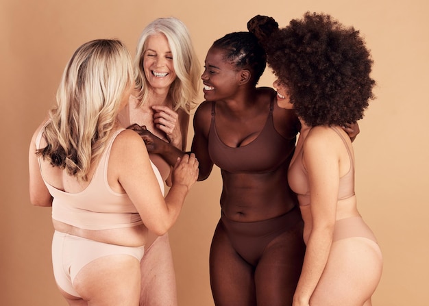 Diversity women and skincare for body positivity wellness and talk on brown studio background Cosmetics females or multiracial ladies conversation natural beauty or confident with smile or laugh