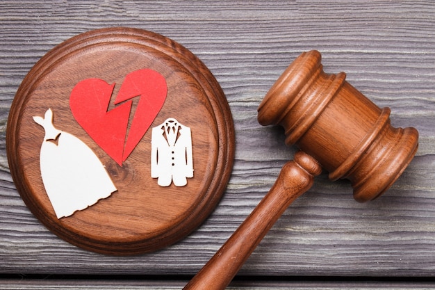 Photo divorce concept flat lay. broken heart and gavel.