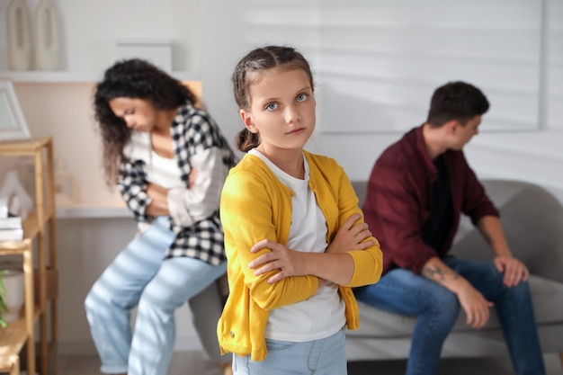 Divorce concept Sad couple and their daughter at home
