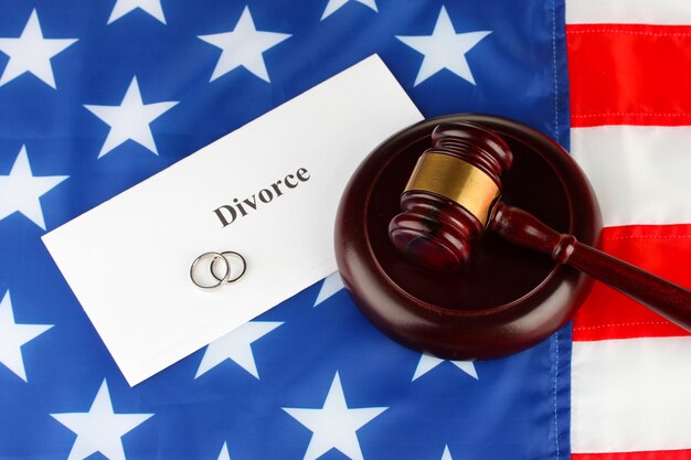 Photo divorce decree and wooden gavel on american flag background