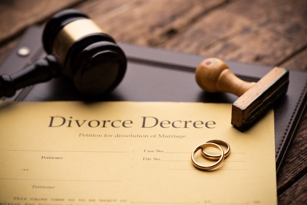 Divorce decree and wooden gavel close up