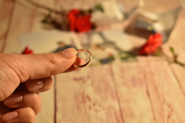 Divorce and separation of couples. Woman holding a wedding ring