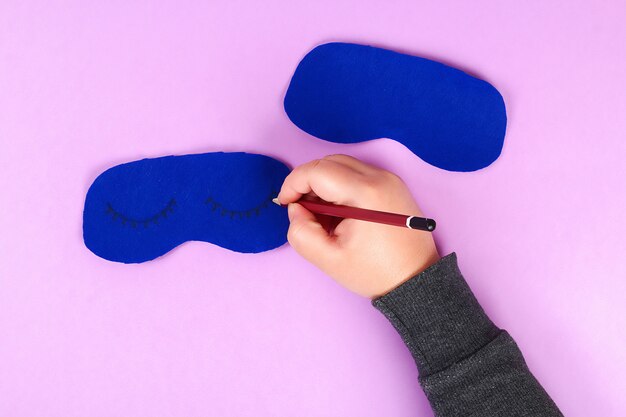 Diy blue felt sleep mask with white thread embroidered