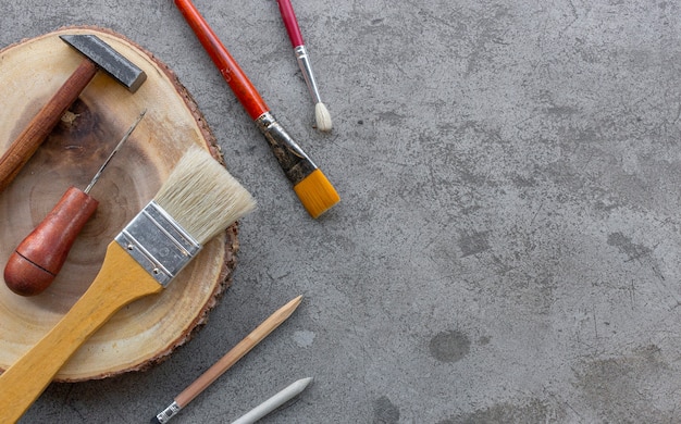 DIY concept. craft tools set on cement background. top view