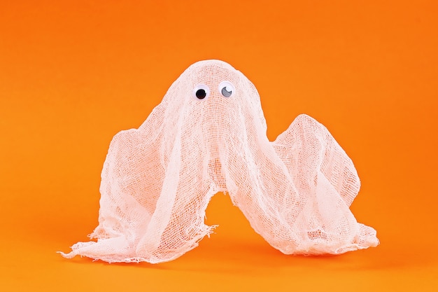 Diy Halloween ghost of starch and gauze orange. Gift idea, decor Halloween. Step by step