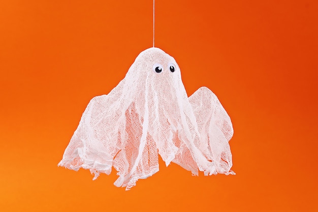 Diy Halloween ghost of starch and gauze orange. Gift idea, decor Halloween. Step by step