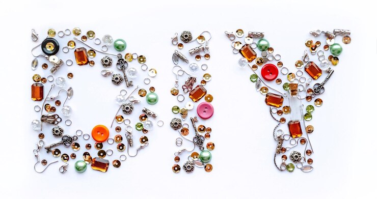 Diy lettering collected from handmade tools such as buttons ear wires locks sequins pendants on a