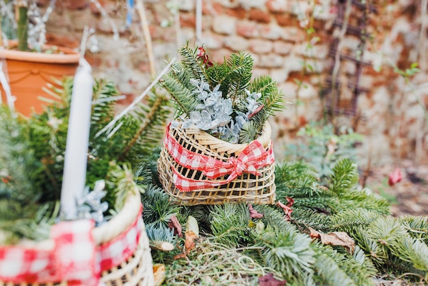 DIY natural Christmas decoration outdoor Pine branch in straw basket