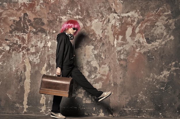 Dj girl in pink wig with headphones