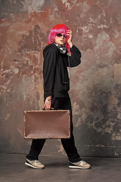 Dj girl in pink wig with headphones