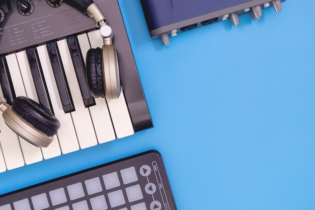 DJ home studio equipment top view with blue copy space