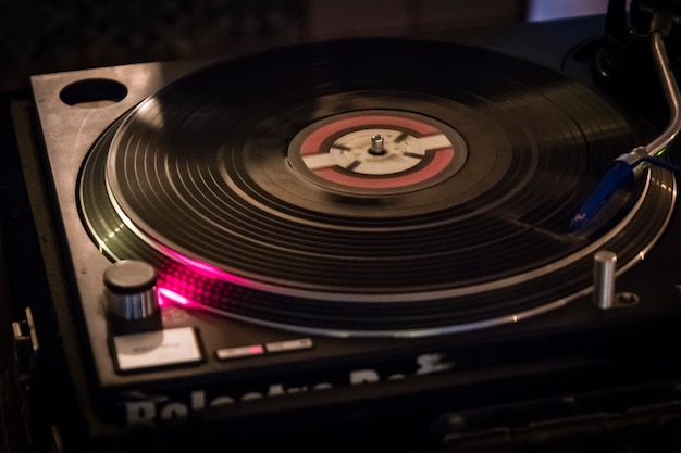 DJ was playing music with vinyl plates