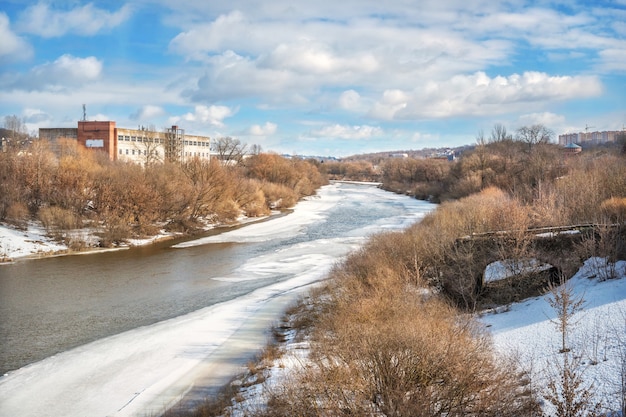 Dnieper river and the remains of the old bridge in Smolensk under the spring blue sky