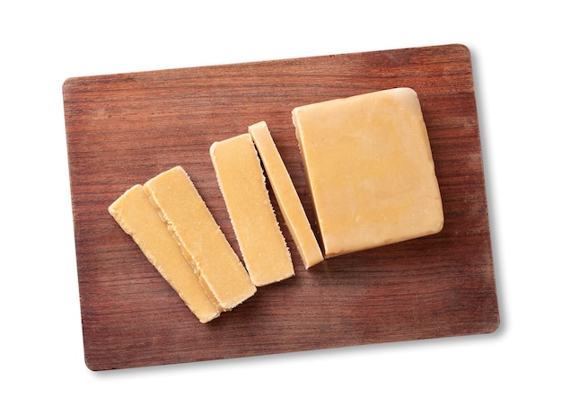 Doce de leite or dulce de leche traditional south american milk candy over wooden board isolated over white background