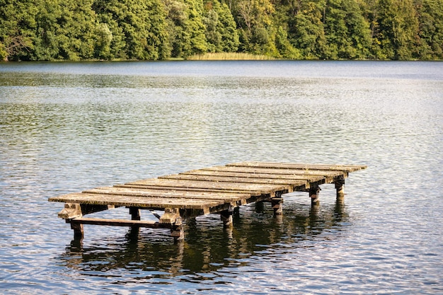 a dock is in the middle of a lake.