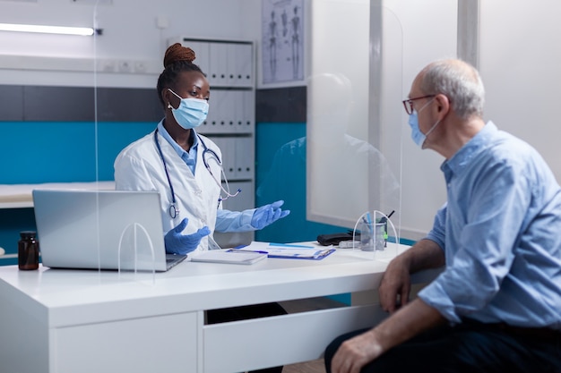 Doctor of african american ethnicity wearing face mask