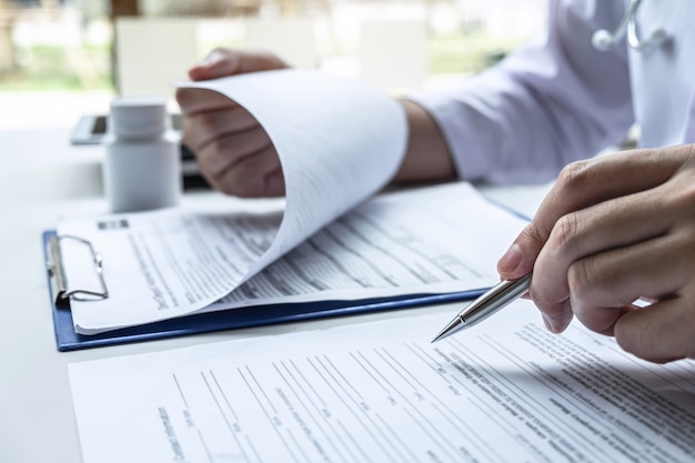 Doctor analyses diagnosis health and consults treatment of disease.