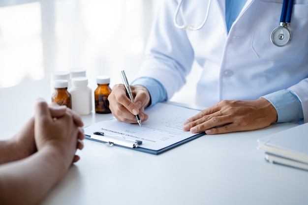 Doctor are recommending medicines to patients after being examined and diagnosed by the patient's doctor the concept of treatment and symptomatic medication dispensing by the pharmacist