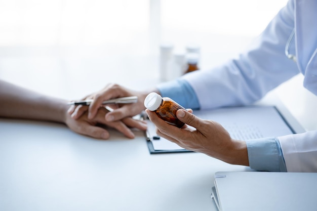 Doctor are recommending medicines to patients after being examined and diagnosed by the patient's doctor the concept of treatment and symptomatic medication dispensing by the pharmacist