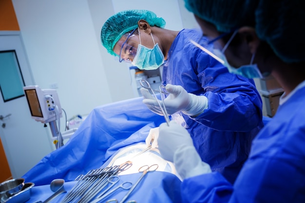 doctor and assistance Medical team performing surgery on a patient